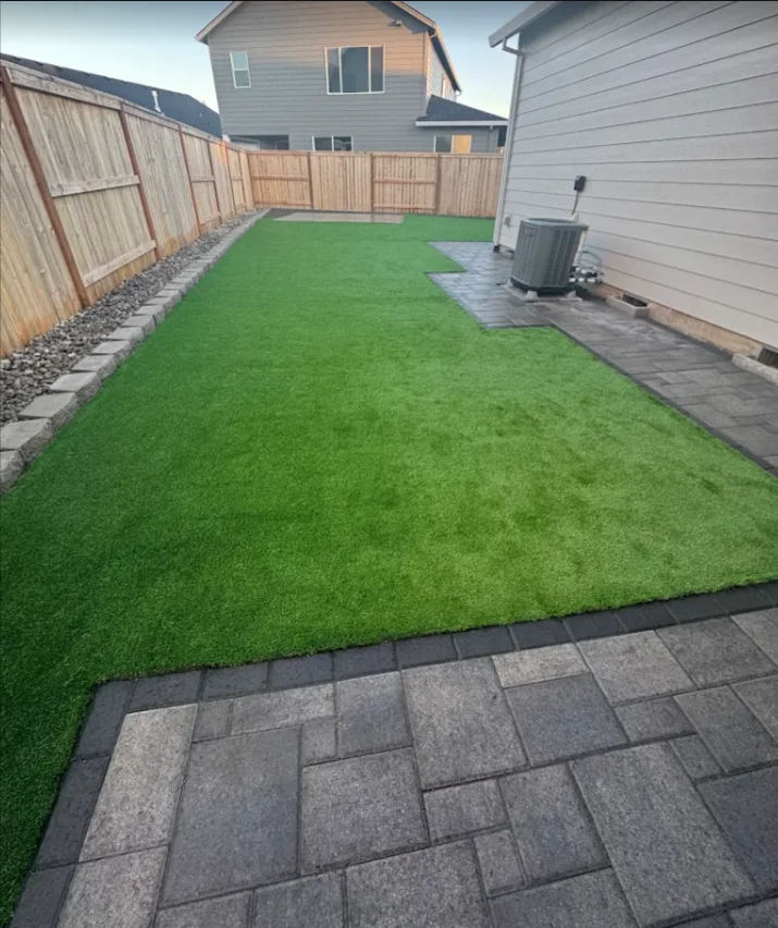 Lush artificial turf installation in a residential McMinnville, OR backyard