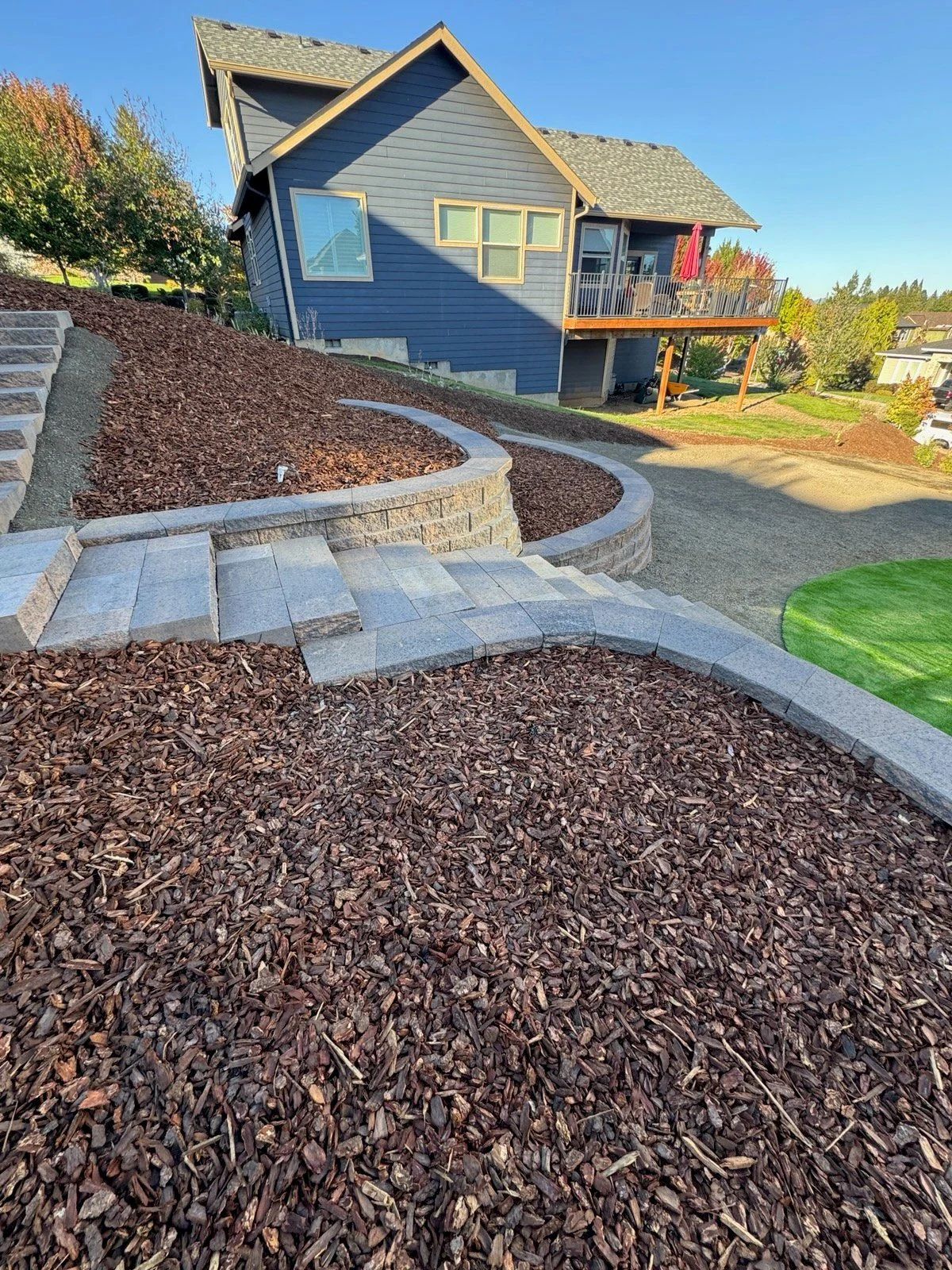 Newly constructed block retaining wall on a sloped McMinnville, OR residential property